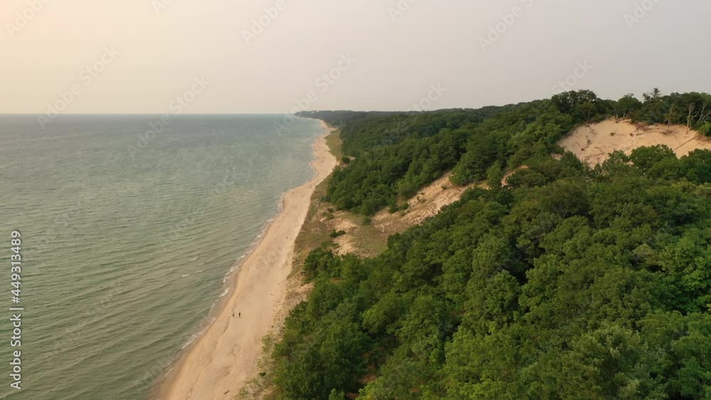 Warren Dunes State Park on the shore of Lake Michigan. 
Aerial view of sand dunes in state Michigan. Summer, sunset soft sunlight