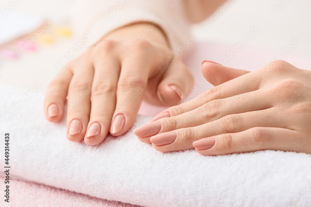 Woman with beautiful manicure in salon