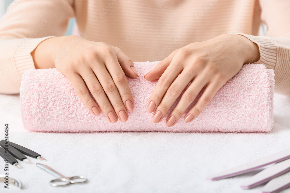 Woman with beautiful manicure in beauty salon, closeup Woman with beautiful manicure in beauty salon, closeup