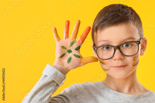 Cute little boy in paint on...