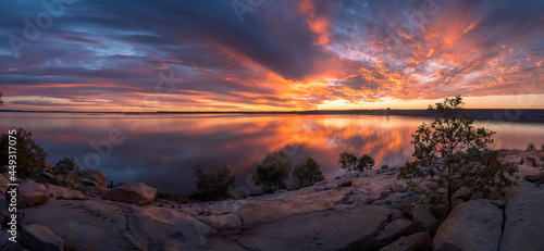 Beautiful Panoramic Lakeside Sunset with Cloud Reflections