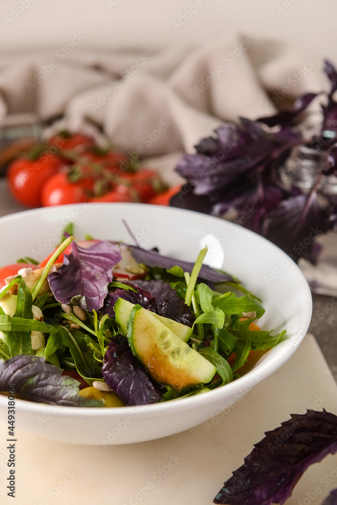 Bowl with tasty fresh salad on table, closeup Bowl with tasty fresh salad on table, closeup
