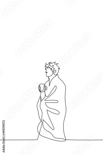 shaggy man covered with a blanket carries a mug of tea or coffee - one line drawing. concept of early morning, day off