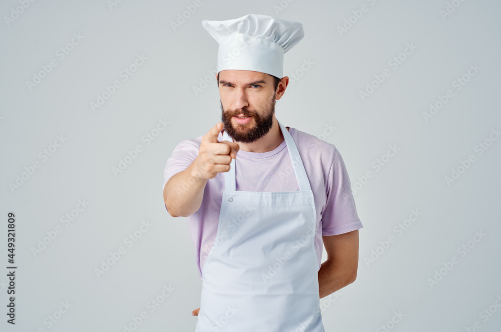 a bearded man in a chef's uniform gestures with his hands the emotions of professionals a bearded man in a chef's uniform gestures with his hands the emotions of professionals