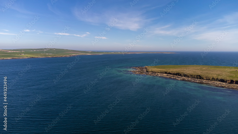 An aerial view of the coast of Orkney in Scotland, UK