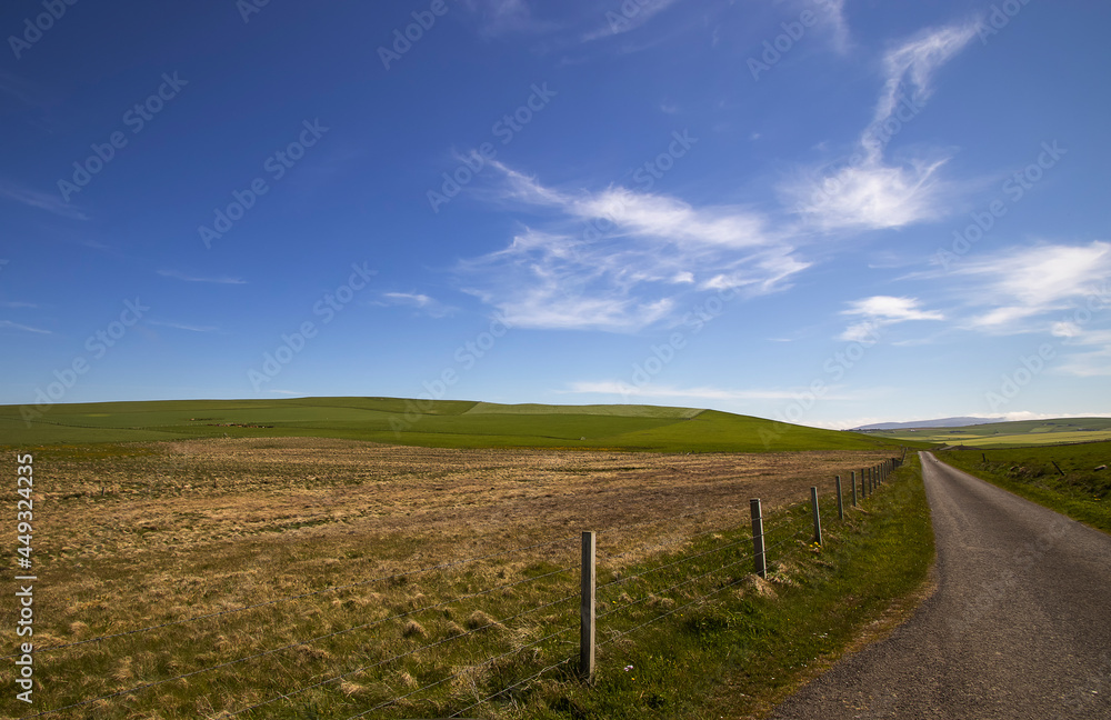 A rural landscape of Orkney Islands in Scotland, UK A rural landscape of Orkney Islands in Scotland, UK