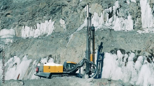 Drilling machine is operating at the mine site photo