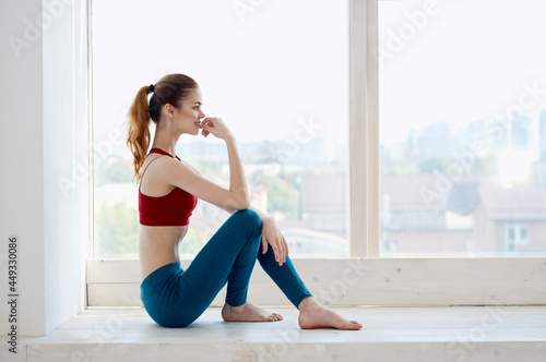woman sitting on the floor exercise yoga fitness lifestyle