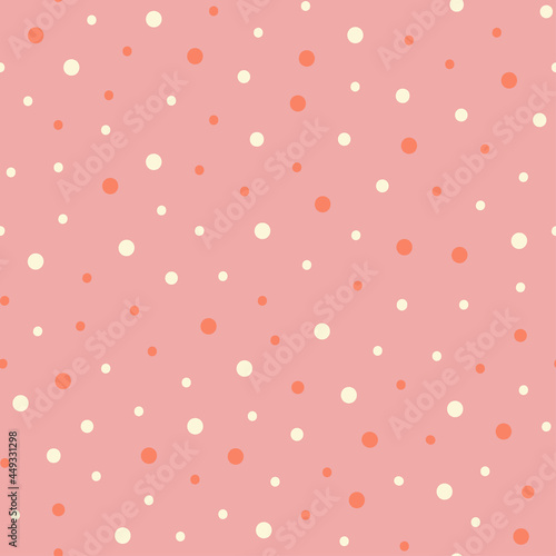 Seamless pattern with dots on a pink background. Abstract pattern in pink tones.
