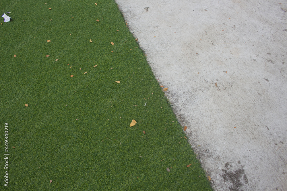 Obraz premium green artificial grass as a rough floor covering