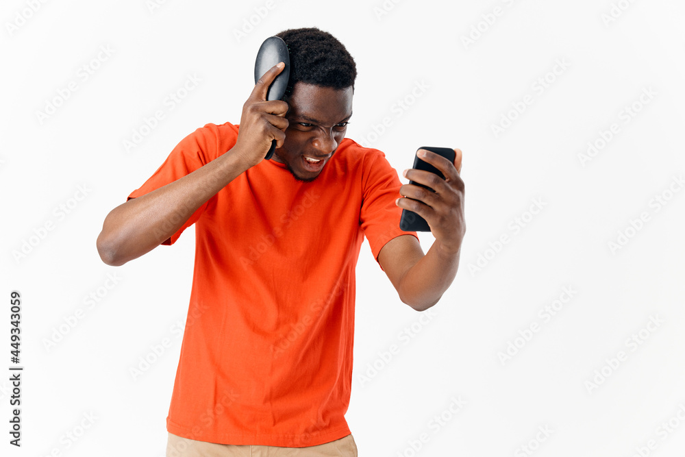 a man with a comb in his hands looks at the phone hairstyle head care a man with a comb in his hands looks at the phone hairstyle head care