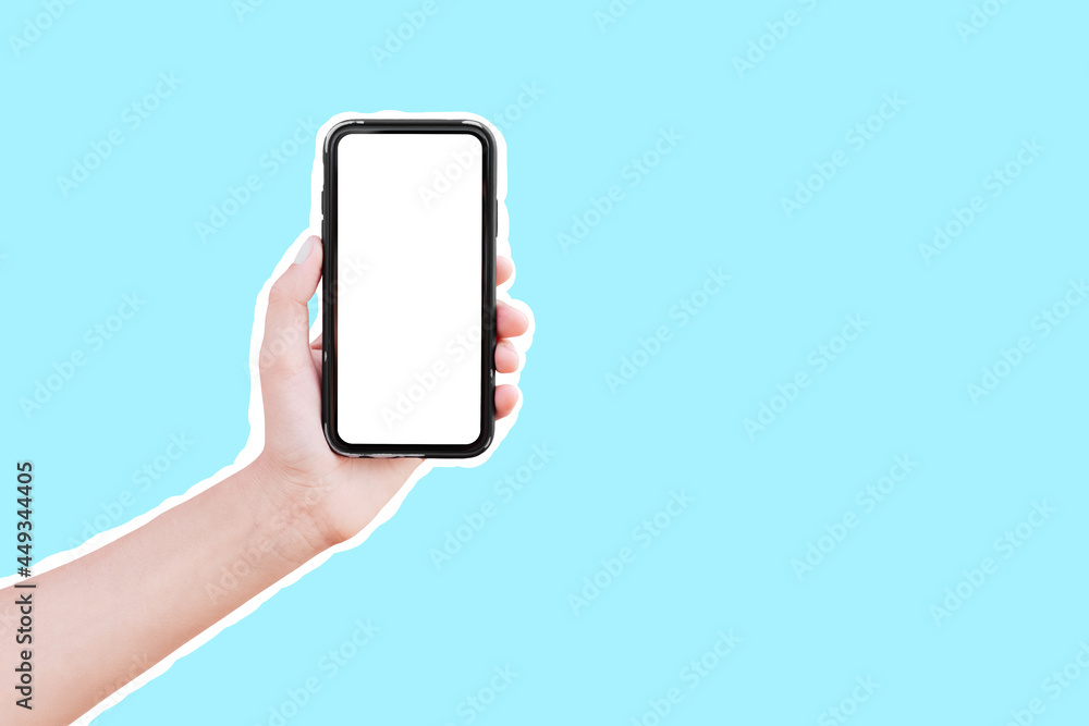Male hand holding smartphone with mockup, isolated with white contour on blue.