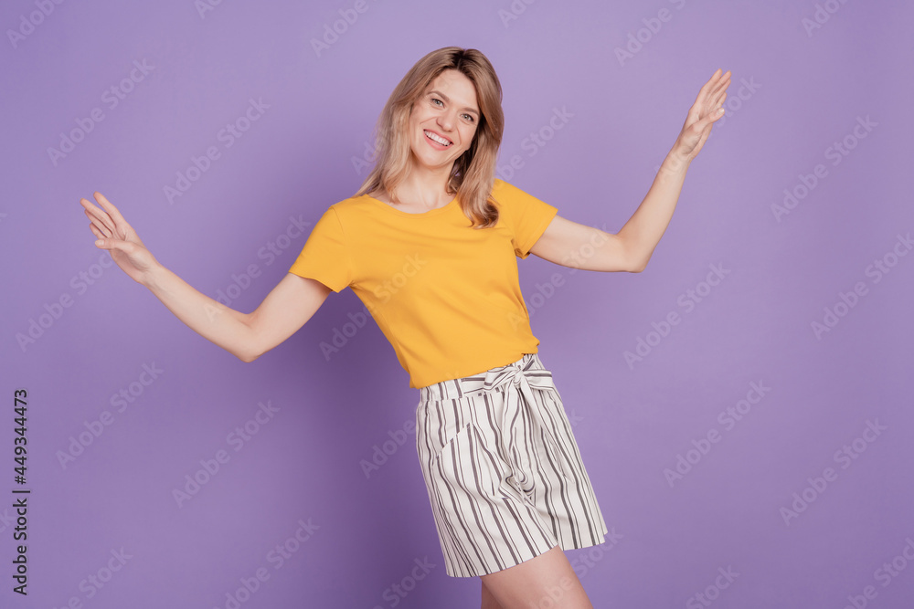 Photo of young cheerful woman happy positive smile have fun dance summer isolated over violet color background Photo of young cheerful woman happy positive smile have fun dance summer isolated over violet color background
