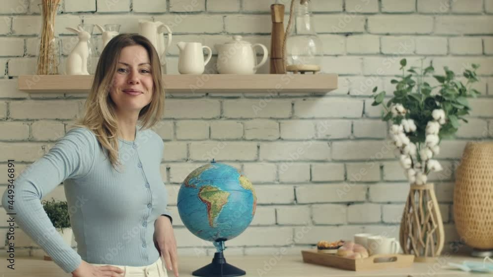 Girl take off mask from globe. Ends up covid worldwide pandemic