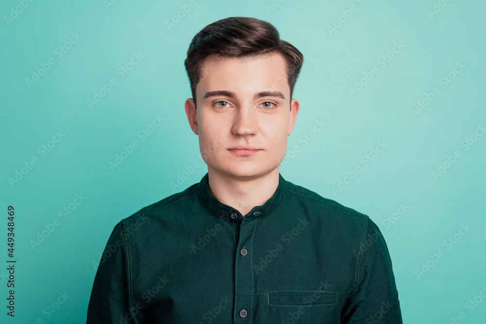 Portrait of serious businessman isolated over teal background Portrait of serious businessman isolated over teal background