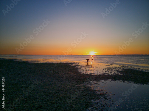 kids play sunset on the beach