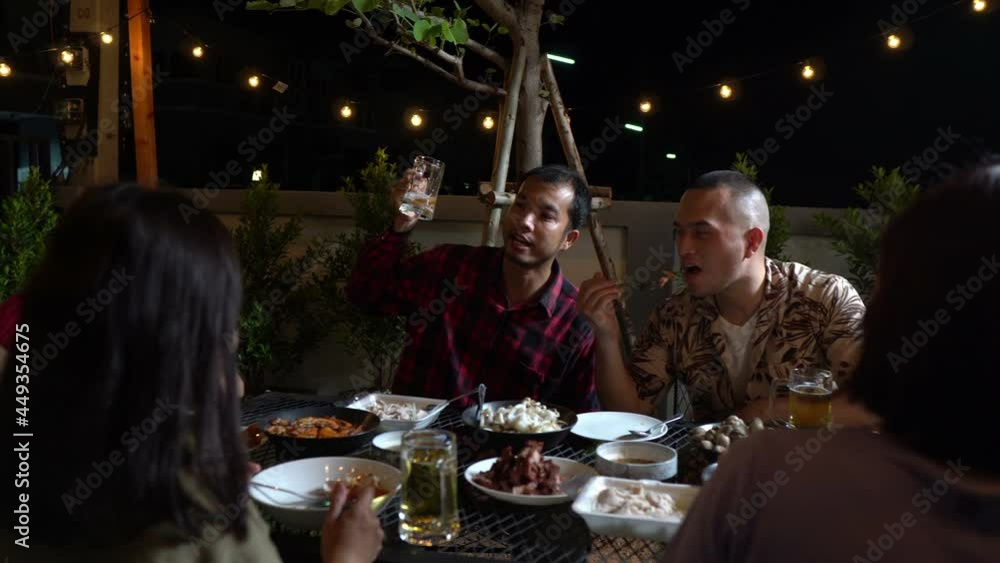 Group of asian people dinning party in the garden of home on holiday,Summer evening garden party celebration with Friends Group of asian people dinning party in the garden of home on holiday,Summer evening garden party celebration with Friends