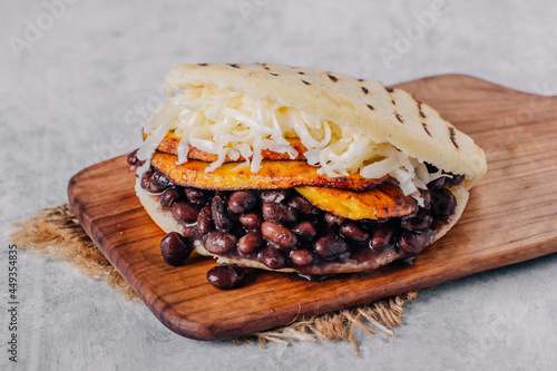  Typical Venezuelan arepa, made with fried plantain, black beans and cheese photo