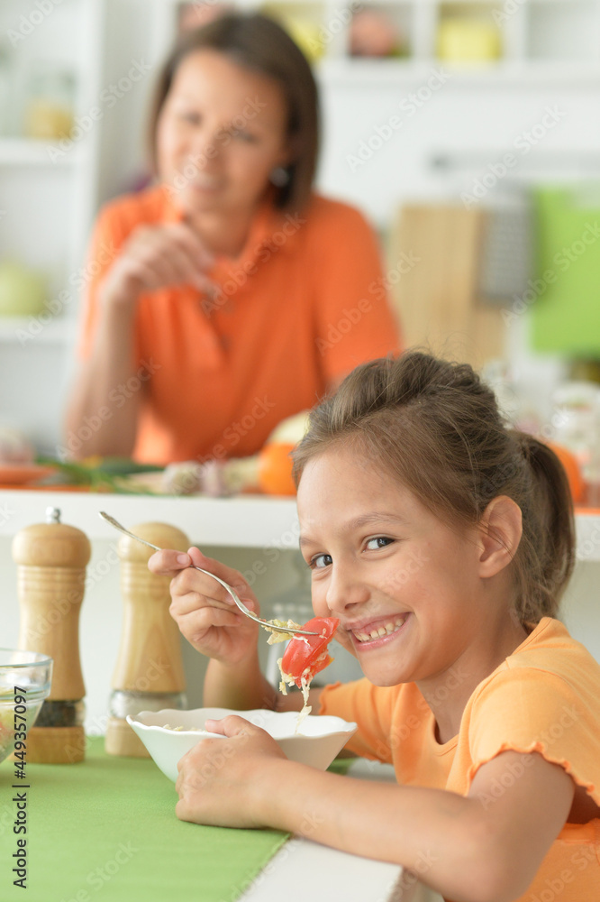 Portrait of a cute little girl with her mother at home Portrait of a cute little girl with her mother at home