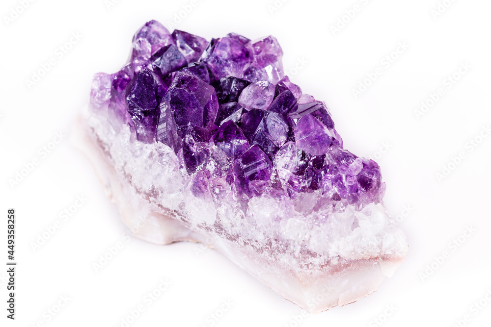 Macro mineral stone purple amethyst in crystals on a white background Macro mineral stone purple amethyst in crystals on a white background