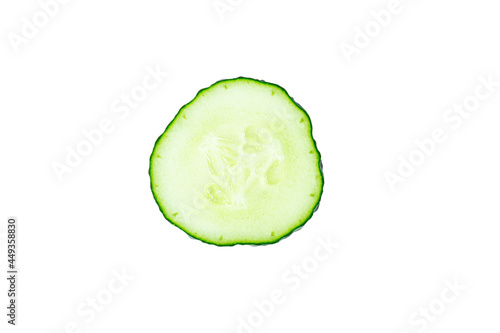 Fresh cucumber single slice or cross-section isolated on white background.