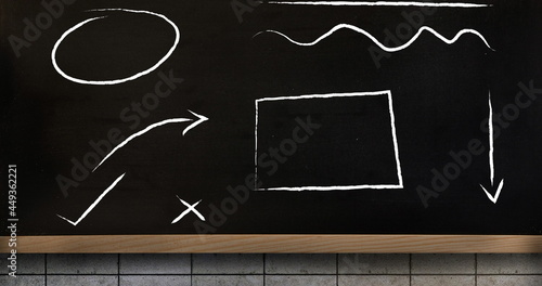 Digital image of abstract shapes over wooden surface against black background