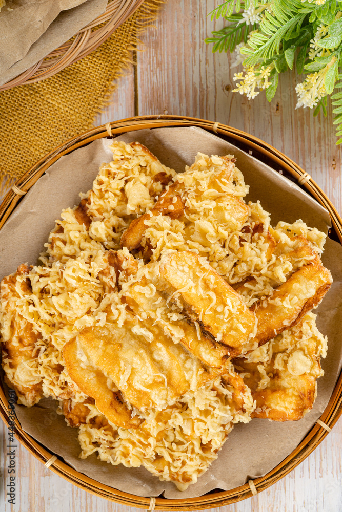 Pisang goreng is a fritter made by deep frying battered plantain in hot