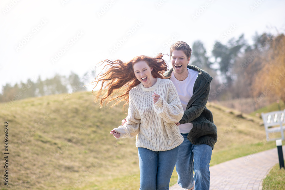 Happy woman and man actively having rest in nature Happy woman and man actively having rest in nature