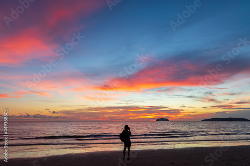 Unidentified Photographer taking a beautiful twilight sunset at Tanjung aru beach, Sabah, Malaysia