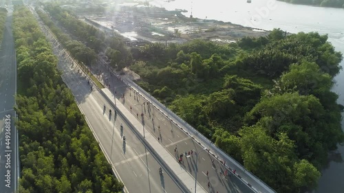 April 2021, Aerial view of people running on Mai Chi Tho boulevard in District 2 or Thu Duc City in Ho Chi Minh City, Vietnam photo