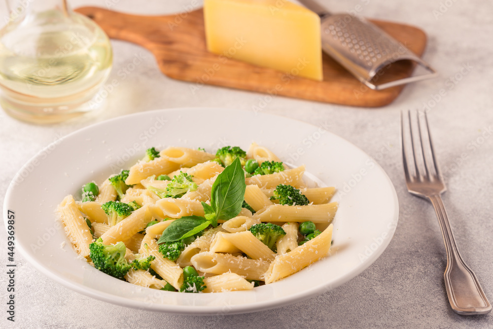 Pasta with green peas, broccoli and parmesan cheese. Pasta with green peas, broccoli and parmesan cheese.