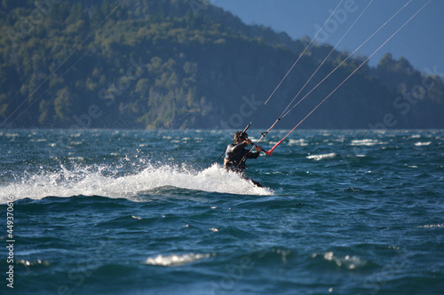 man kitesurfing in lake moreno near bariloche