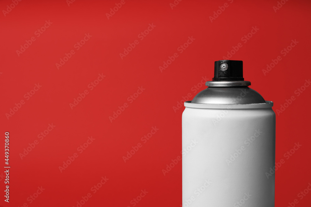 Can of spray paint on red background, closeup with space for text. Graffiti supply Can of spray paint on red background, closeup with space for text. Graffiti supply
