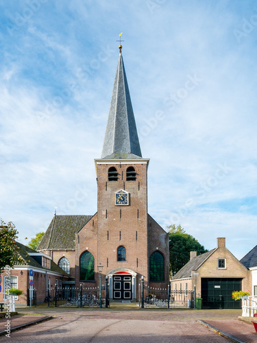 Building of Mauritiuskerk, church with tower in IJlst, Friesland, Netherlands