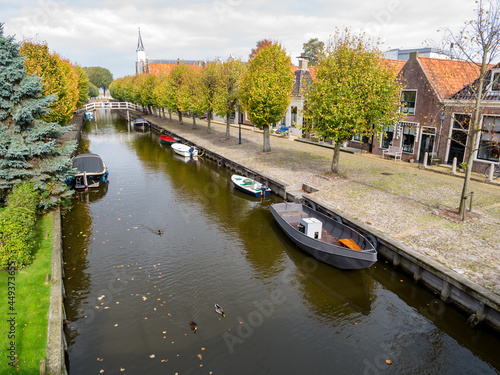 Canal and Heerenwal quay with houses in city of Sloten, Sleat, Friesland, Netherlands