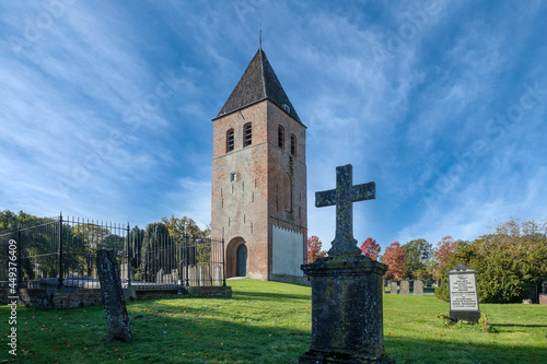 The cemetery of Joure, Friesland with medieval church tower, Friesland province, The Netherlands photo