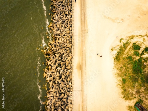 Baltic seawall coastline barricade in Lithuania coast - Melnrages molas, Klaipeda photo