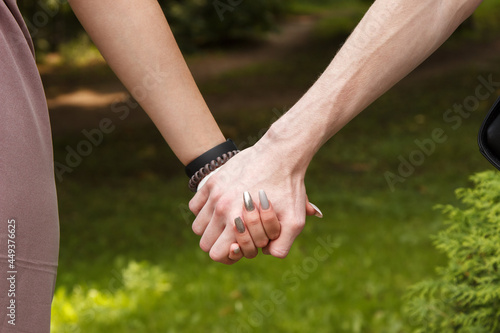 man and woman hold hands. hands closeup © Radnatt
