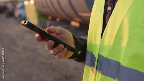 Close up view of man's hand that holds smartphone