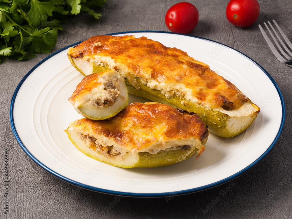 zucchini stuffed with meat under a cheese crust zucchini stuffed with meat under a cheese crust