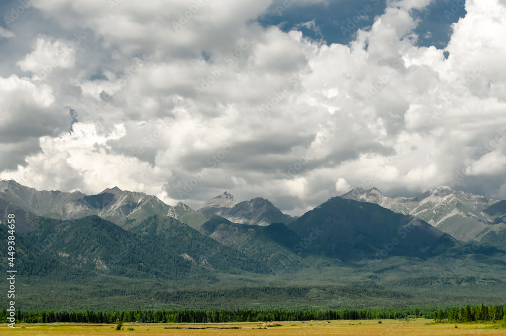 Obraz premium mountains and clouds at daylight in summer