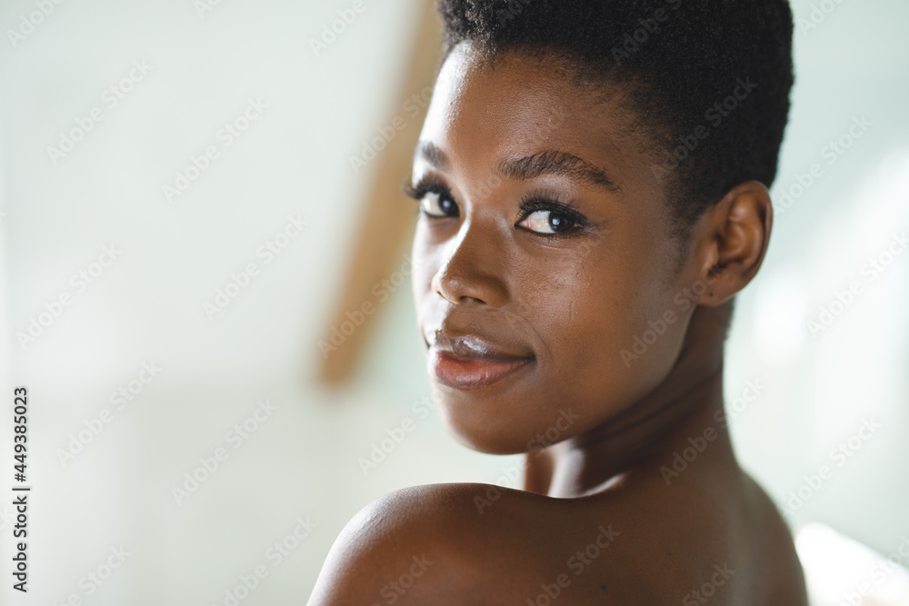 Portrait of smiling african american woman in bathroom looking at camera Portrait of smiling african american woman in bathroom looking at camera