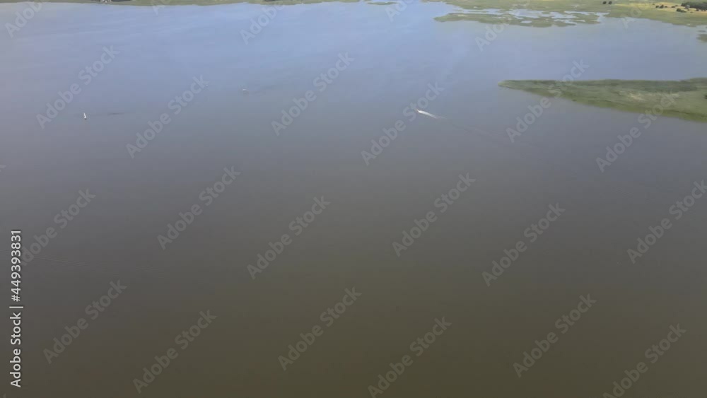 A bird's-eye view of the Siemianówka dam reservoir in the upper Narew valley.A bird's-eye view of two water pools separted track connected by a bridge. A bird's-eye view of the Siemianówka dam reservoir in the upper Narew valley.A bird's-eye view of two water pools separted track connected by a bridge.