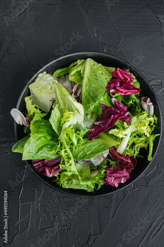 Frieze, romaine and Radicchio lettuce, on black background, top view flat lay