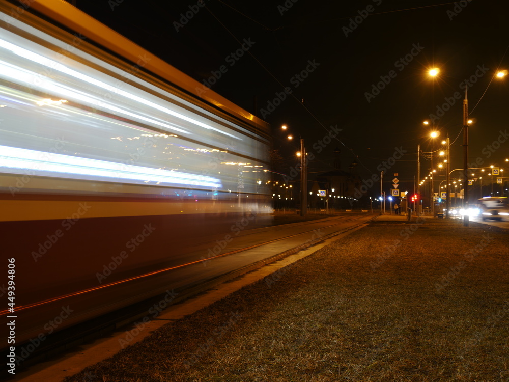 tram blurry motion  passing by at night, long exposure