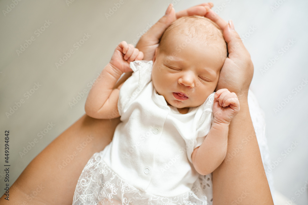 Cute little baby girl under 1 year old wear white bodysuit dress