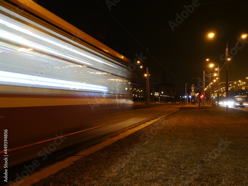 tram blurry motion passing by at night, long exposure