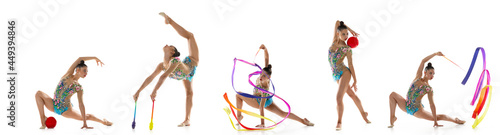 In motion. Young female rhythmic gymnast training isolated over white background. Flyer photo