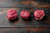 Raw fresh marbled meat Steak filet mignon , on old dark  wooden table background, with copy space for text