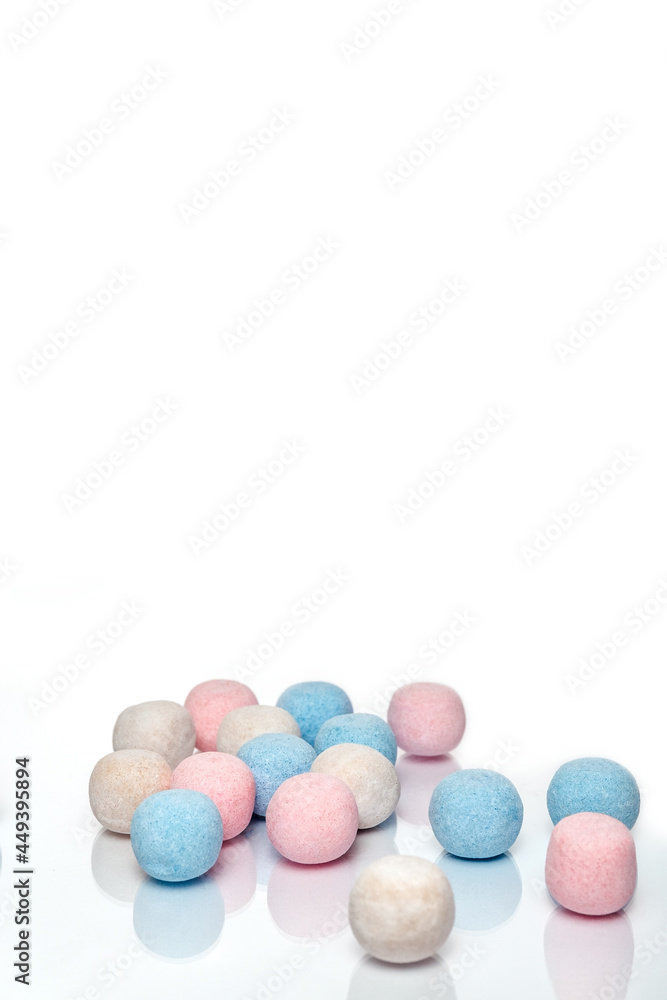 Multicolored round candies on a white background. Round sweets. Isolate. Photo Multicolored round candies on a white background. Round sweets. Isolate. Photo